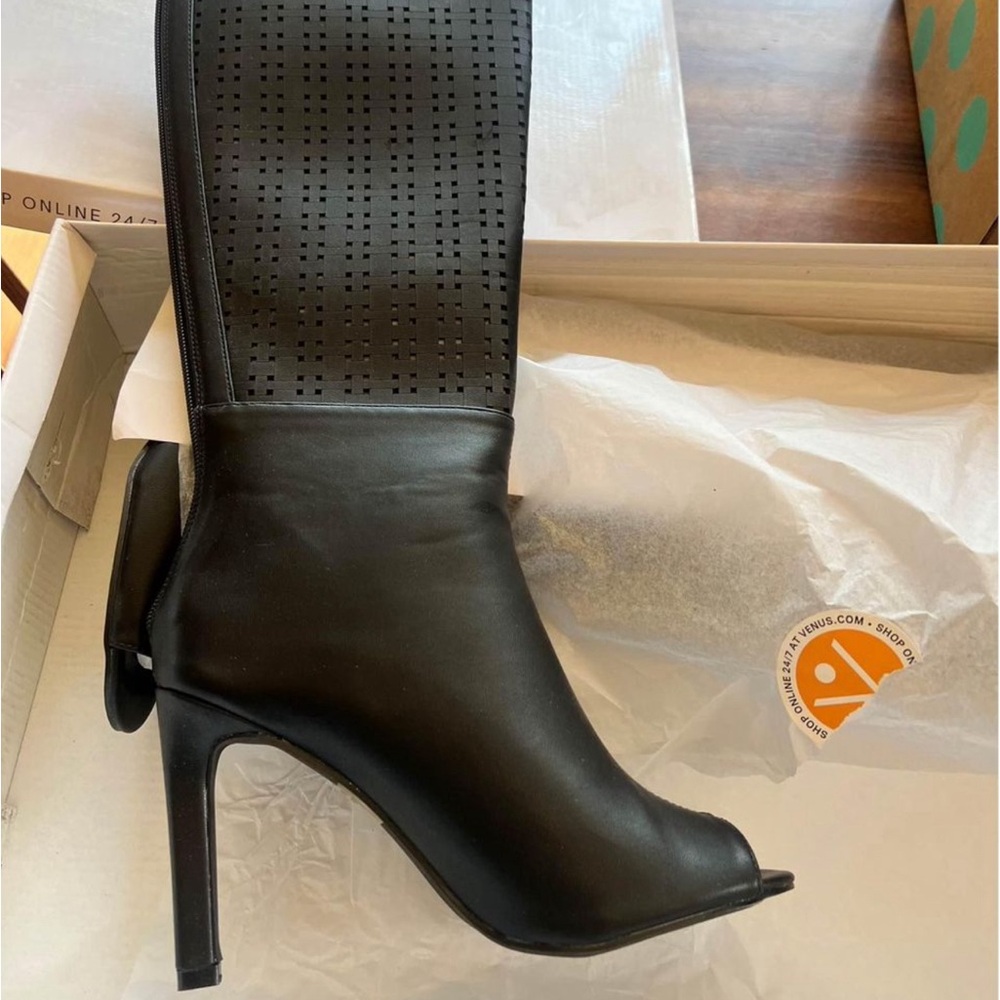 Black peep toe, tall, stiletto boot from Venus. Size 8.